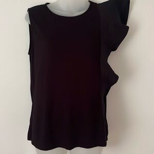 Asymmetrical top with shoulder ruffle